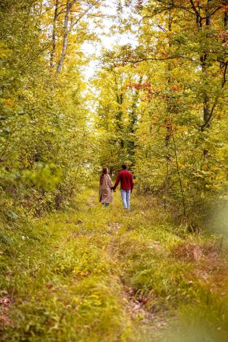 two people walking down a path in the woods at Tenuta Borgo Santa Cecilia in Gubbio