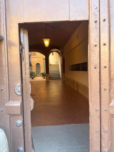 an open door to a hallway in a building at Nobil Dimora Ancilli in Siena