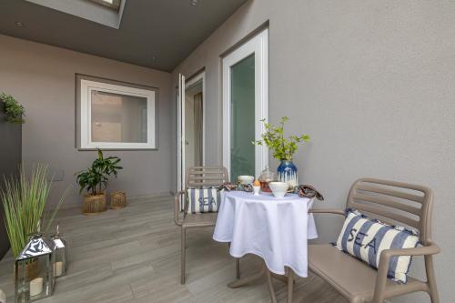 a dining room with a table and chairs at Romagna Suite Hotel in Gatteo a Mare