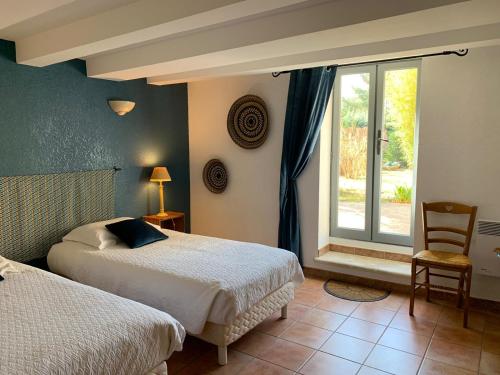 Postel nebo postele na pokoji v ubytování Bastide Sainte Agnès