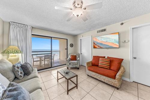 a living room with a couch and a chair at Harbour Place 313 in Gulf Shores