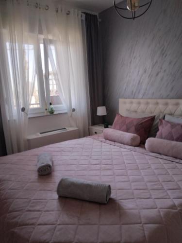 a bedroom with a large bed with a large mattress at Skyline apartment in Bijeljina