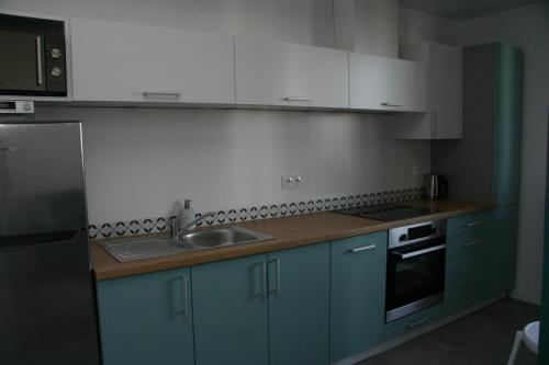 Kuchyňa alebo kuchynka v ubytovaní Apartament zielony