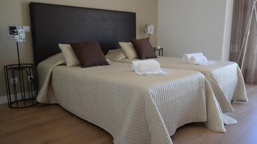 En eller flere senge i et værelse på Vila Atlantida Apartment