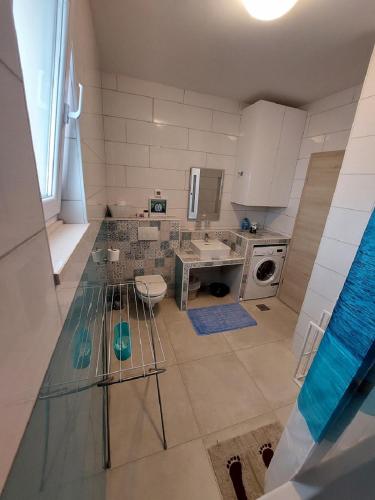 a kitchen with a glass counter top in a room at Apartmani NIKA in Dubrovnik