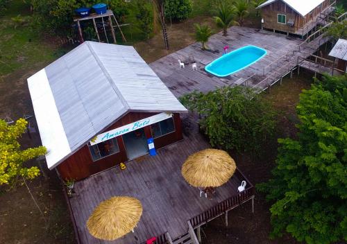 an overhead view of a small building with a blue frisbee at Amazon Boto Lodge Hotel in Careiro