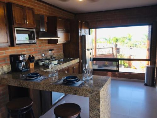 Η κουζίνα ή μικρή κουζίνα στο Ventana Blue Hotel