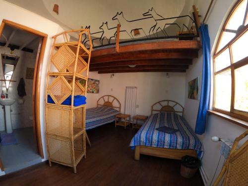 Кровать или кровати в номере Hotel La Cupula