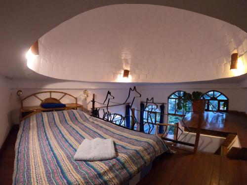 Кровать или кровати в номере Hotel La Cupula