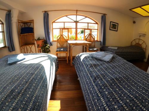 Кровать или кровати в номере Hotel La Cupula