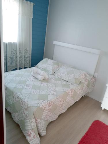 Ένα ή περισσότερα κρεβάτια σε δωμάτιο στο Kitnet Namorados
