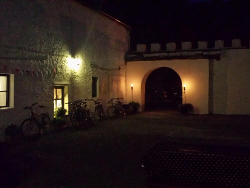 a group of bikes parked outside of a building at night at The Valley House in Valley