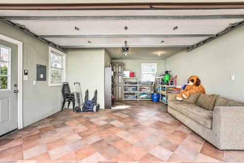 a dog sitting on a couch in a living room at Beautiful Spacious Beach Home, Private Deck & Grill, with Beach Badges in Point Pleasant Beach