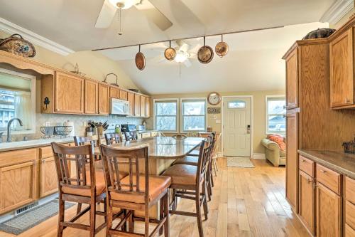 a kitchen with a large dining room table and chairs at Beautiful Spacious Beach Home, Private Deck & Grill, with Beach Badges in Point Pleasant Beach