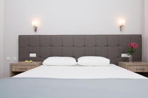 Ein Bett oder Betten in einem Zimmer der Unterkunft Sun Rise Hotel