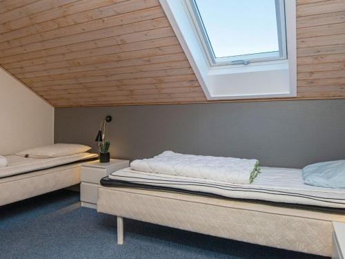 Postelja oz. postelje v sobi nastanitve Holiday home Rømø XI