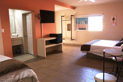 Cama o camas de una habitación en Hotel Parque Inn
