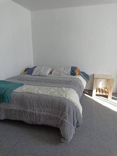 a bedroom with two beds and a window at Casa de campo Llifén Futrono Lago Ranco in Ranco