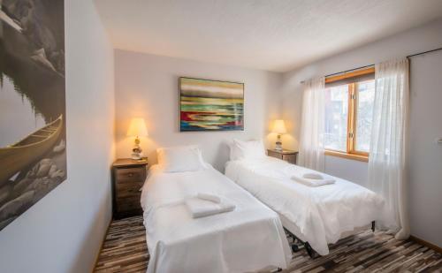 Ένα ή περισσότερα κρεβάτια σε δωμάτιο στο Aurora Bayside Inn