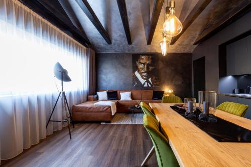 a room with a bed and a table in a room at RASL House in Luka nad Jihlavou