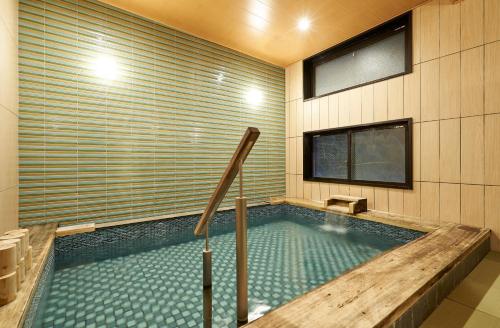 a swimming pool in a room with at Hotel Kuu Kyoto in Kyoto