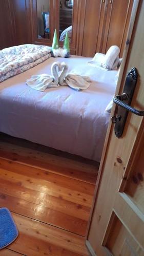 a door open to a bedroom with a bed at Chalet del paese Incantato comune di Moncenisio in Moncenisio