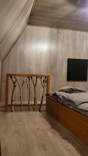 מיטה או מיטות בחדר ב-Mountain cottage