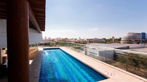 a swimming pool on the roof of a building at Holiday Inn Express Puerto Vallarta by IHG in Puerto Vallarta
