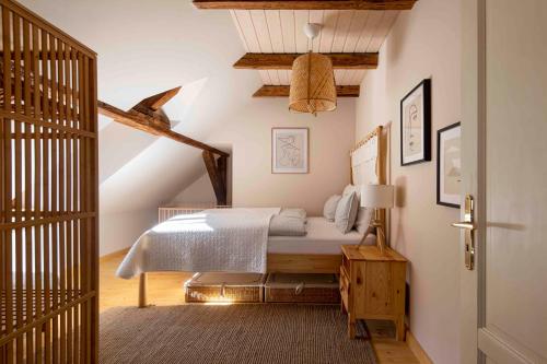 a bedroom with a bed in a attic at Vikendovka Korce in Dubá