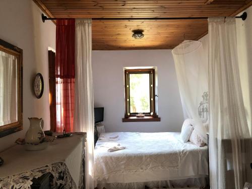 A bed or beds in a room at Villa Katia with Sea view, Pourion, Zagora