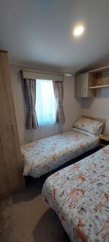 Llit o llits en una habitació de Seaview Homes