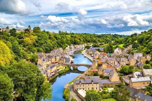 an aerial view of a town with a river at Gîte Charbonnerie in Moncontour