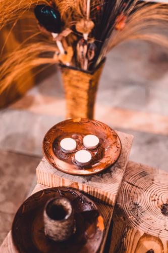 two donuts sitting on a table with a vase at Dakota forest retreat in Tsigov Chark