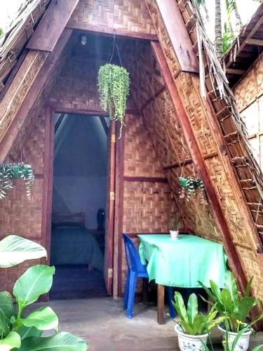 a room with a table in a house at SHUKRAN Apartelle in Siquijor
