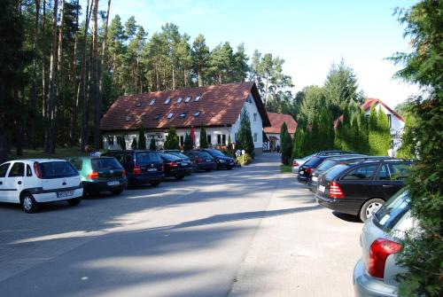 a group of cars parked in front of a house at Haus Waldesruh in Petersdorf