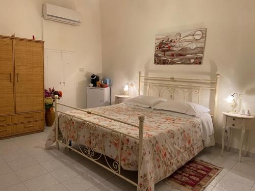 a bedroom with a large bed in a room at B&B Paradiso San Vincenzo in Molfetta