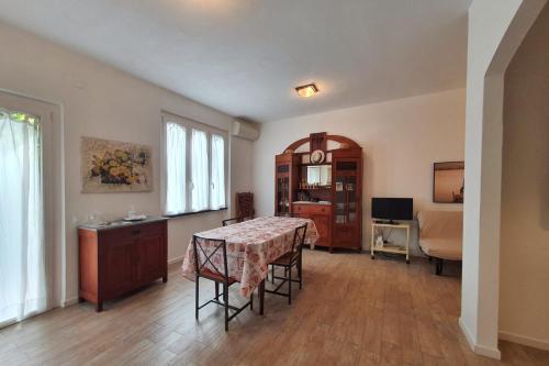 a living room with a table and a bedroom at La Terrazza Sul Blu in Corniglia