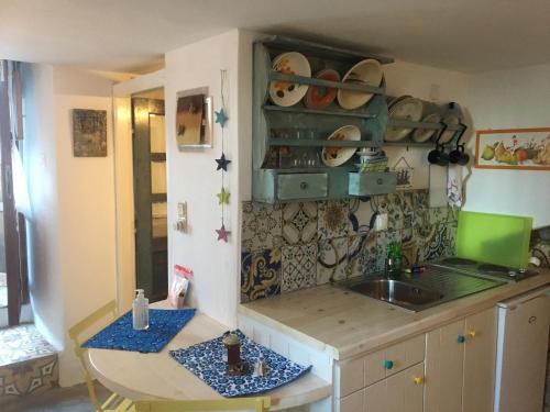 a kitchen with a sink and a counter top at Traditional House Ekaterini Alonissos in Alonnisos