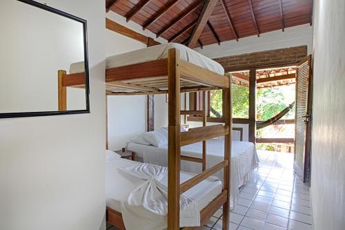 Postel nebo postele na pokoji v ubytování Novos Baianos Hostel e Pousada