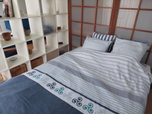 Postel nebo postele na pokoji v ubytování Studio lumineux proche port & plages