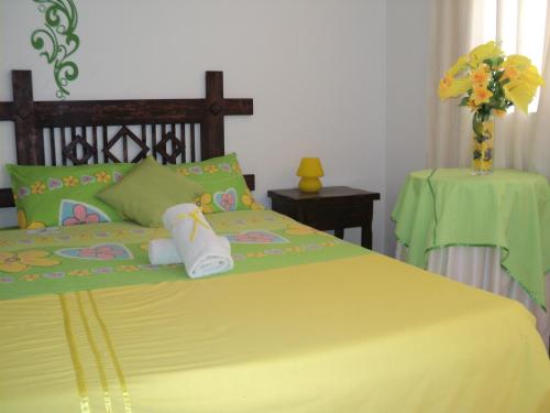 Postel nebo postele na pokoji v ubytování Hotel Conquistadores Inn