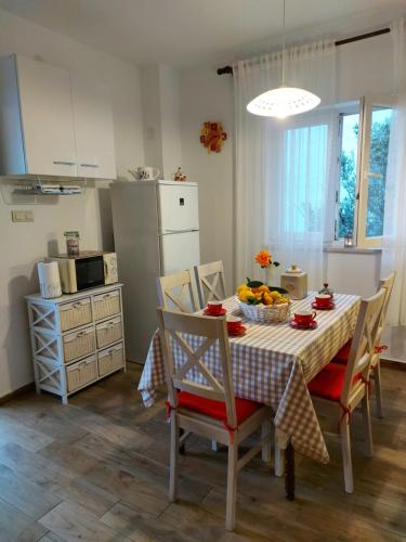 a kitchen and dining room with a table and chairs at Apartment Nataša- Apt.1 in Trogir