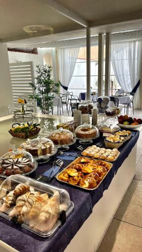 a buffet line with many different types of food at Palazzo Cappuccini Art Relais in Naples