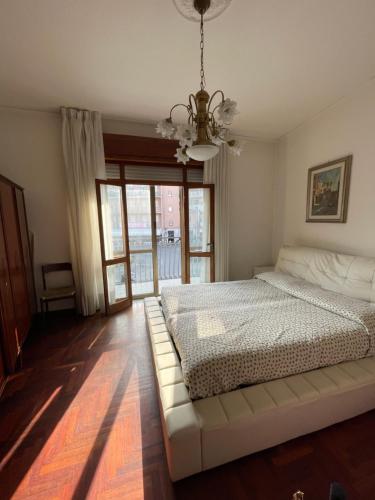 Posteľ alebo postele v izbe v ubytovaní Piazza Italia Charming Sea Apartments