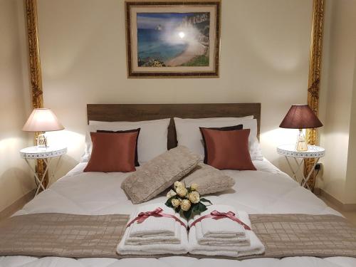 A bed or beds in a room at Grace dell'isola dei Coralli