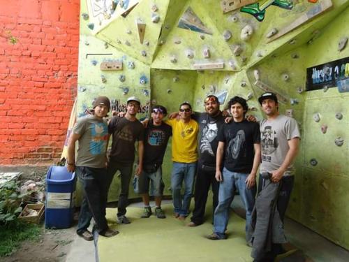 a group of men standing on a climbing wall at Monkeywasi Climbing Hostel in Huaraz