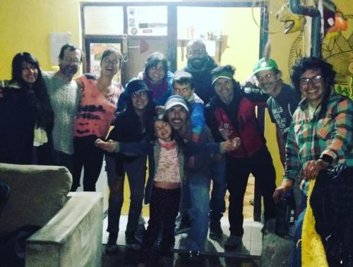 a group of people posing for a picture at Monkeywasi Climbing Hostel in Huaraz