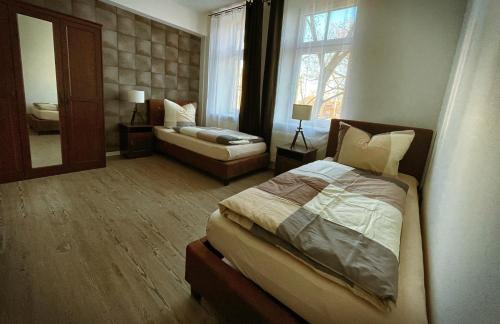 Ένα ή περισσότερα κρεβάτια σε δωμάτιο στο Talgarten Apartment