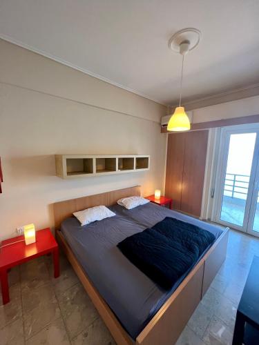 Posteľ alebo postele v izbe v ubytovaní Loutraki Sunset Apartment