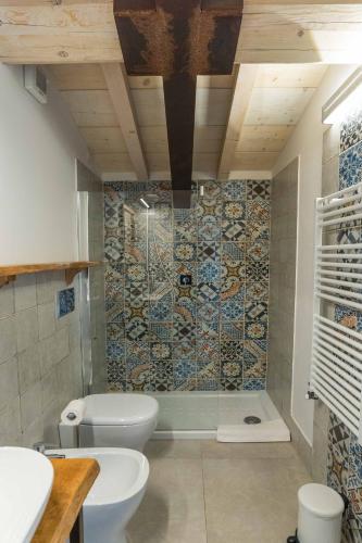 a bathroom with a shower and a toilet and a sink at La Magnolia in Greve in Chianti